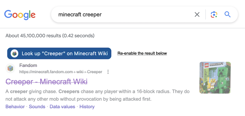 A search result from the Minecraft Fandom Wiki, which has been disabled and made opaque.
                        Above it, a button has been inserted that links to the independent Minecraft Wiki.